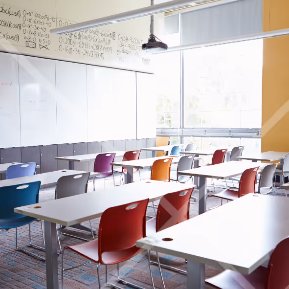 Man talking on a phone sitting at a laptop Best System Cloud Cyber Security Solutions
